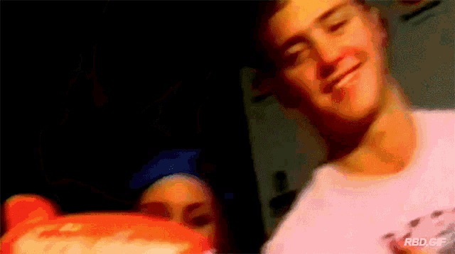 a blurry picture of a man and a woman with the words rbd.gif below