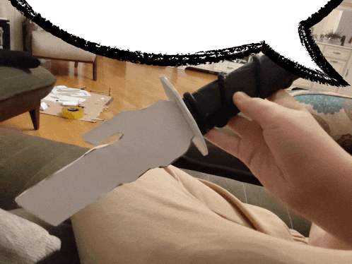 a person holding a cardboard sword with a speech bubble behind them