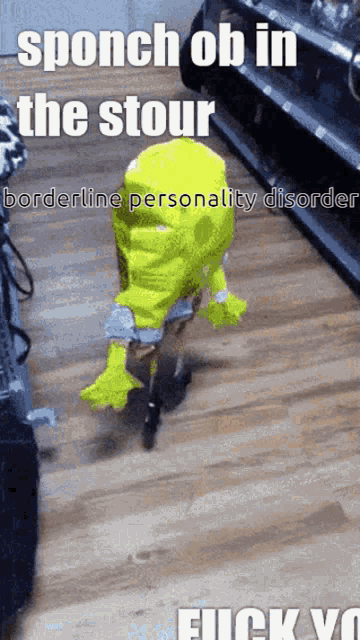 a person in a shrek costume is walking on a wooden floor