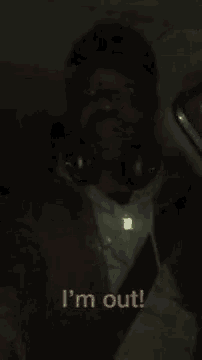 a man is taking a selfie in the dark and says `` i 'm out ! ''