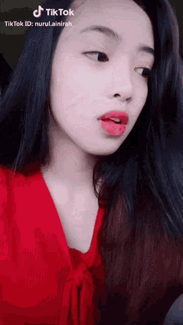 a tiktok video of a girl with red lips