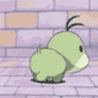 a green and white cartoon dinosaur is standing on a brick floor .