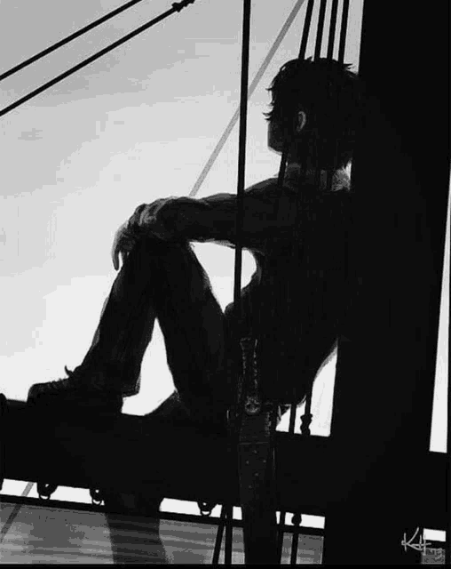 a black and white photo of a person sitting on a railing with the letters kf on the bottom