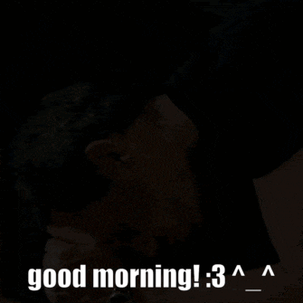 a man in a black shirt is laying on the floor with the words good morning : 3 written above him