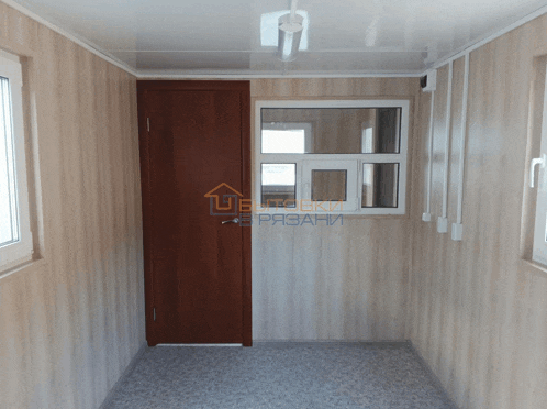 a hallway with a door and a window with the word " ubetoski " on the bottom