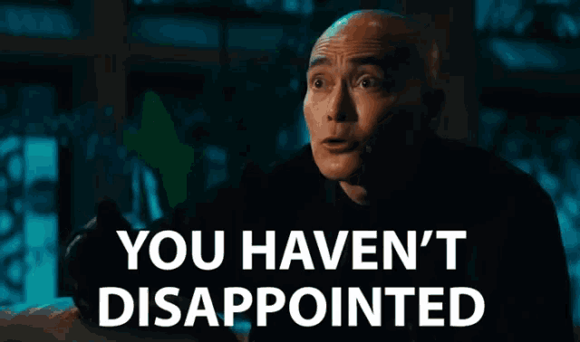 a bald man says you haven 't disappointed in a dark room