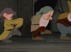 a group of dwarfs from snow white and the seven dwarfs are fighting each other