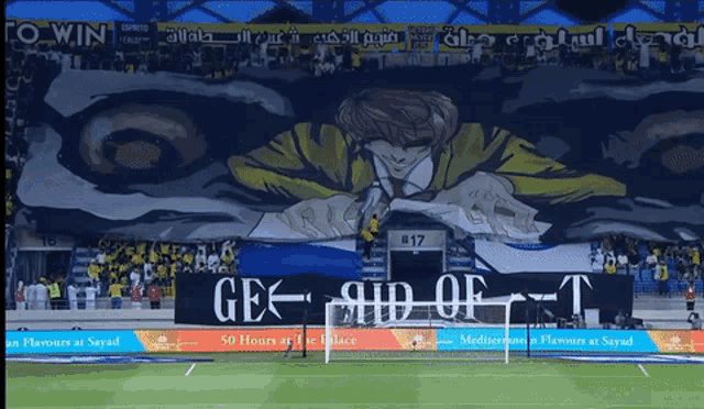 a soccer field with a banner that says gex aid of t.