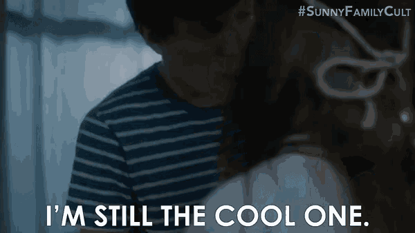 a man and a woman are hugging each other and the woman is saying `` i 'm still the cool one '' .