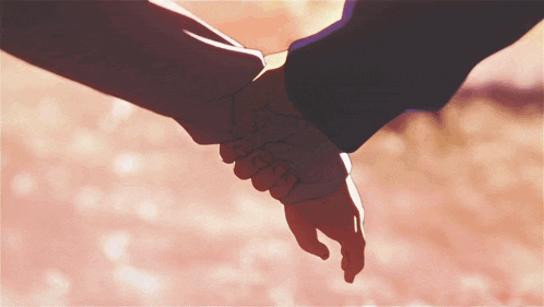 a man and woman holding hands with a pink background
