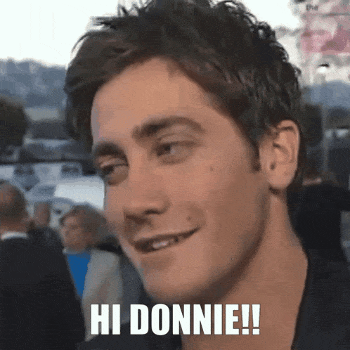 a close up of a man 's face with hi donnie written on it
