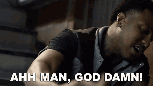 a man says " ahh man god damn " while looking down