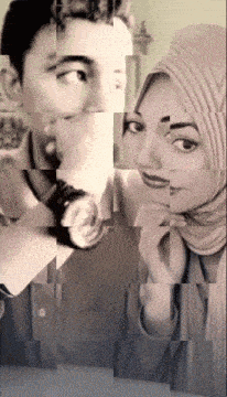a man holding a watch and a woman wearing a head scarf