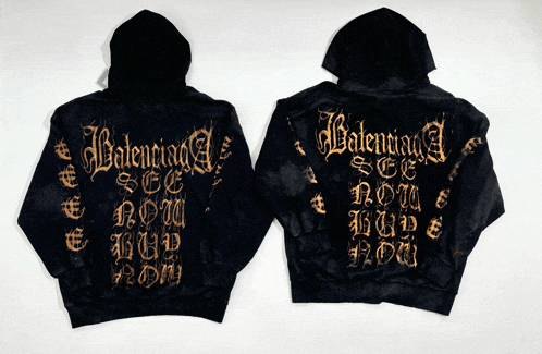two black hoodies with gold balenciaga written on the back