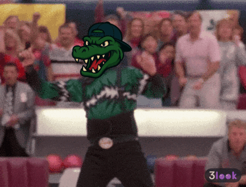 a cartoon drawing of a crocodile mascot with a crowd in the background