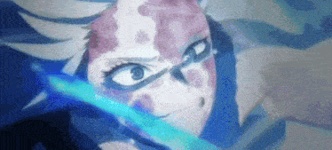 a close up of a person with a sword in their hand .