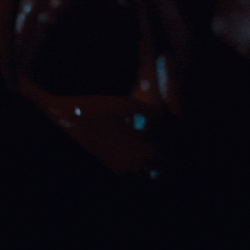 a dark background with a few white lines