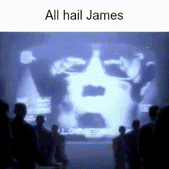 a group of people are watching a projection of a man 's face and the words all hail james