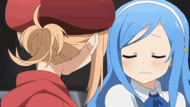 a girl with blue hair and a red hat kisses another girl
