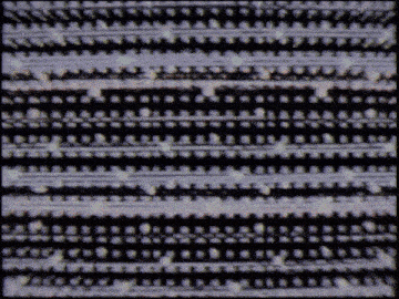 a black and white striped pattern with a few white dots