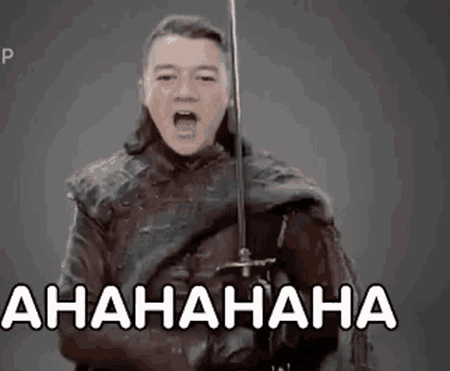 a man is holding a sword and making a funny face while laughing .