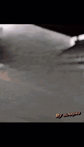 a close up of a gray surface with the words by ulanjhc on the bottom right