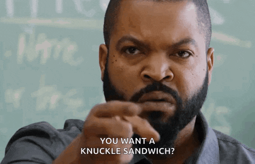 ice cube says you want a knuckle sandwich in front of a chalkboard