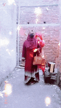 two women are standing in front of a brick wall with tiktok written on the bottom