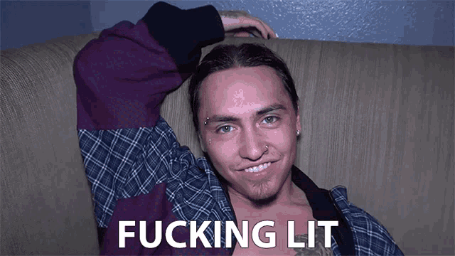 a man laying on a couch with the words " fucking lit " on the bottom