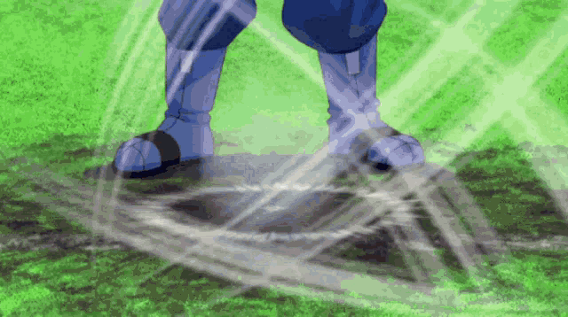 a person in blue boots is standing in a field
