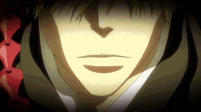 a close up of a man 's face with a shadow behind him