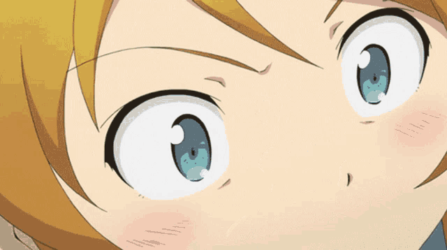 a close up of a girl 's face with blue eyes and a yellow hair