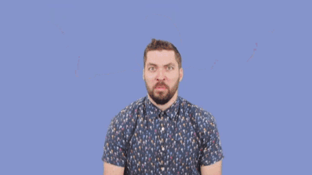 a man with a beard is holding a lightning bolt in his hands