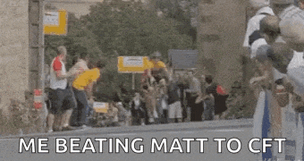 a group of people are standing on the side of a road and a sign that says `` me beating matt to cft '' .