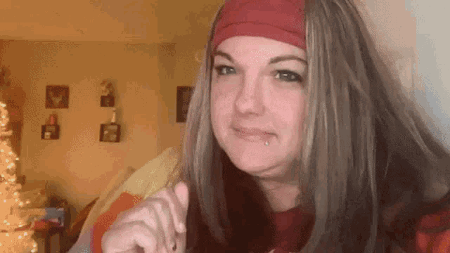 a woman in a pirate costume is giving a thumbs up sign