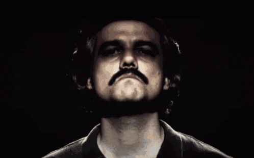 a man with a mustache and the number 02 on the bottom