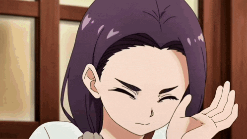 a girl with purple hair is making a funny face with her hand