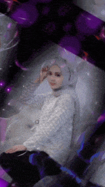 a woman wearing a hijab is surrounded by purple bubbles and a sign that says oppo