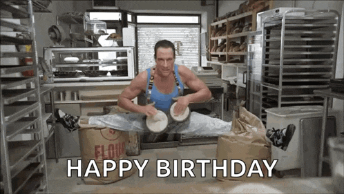 a man is doing a split while playing a drum and the words happy birthday are visible