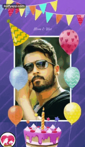 a man with a beard is sitting in front of a birthday cake with balloons and a candle .