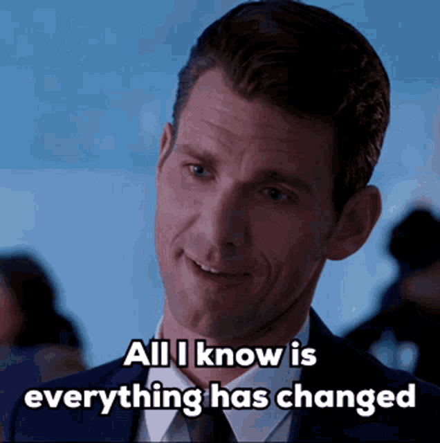 a man in a suit and tie is smiling and says all i know is everything has changed