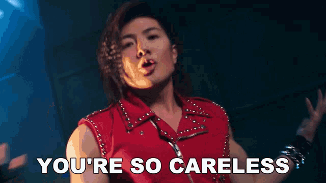 a man wearing a red vest says you 're so careless