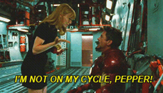 a man and a woman are standing next to each other and the woman is saying i 'm not on my cycle pepper