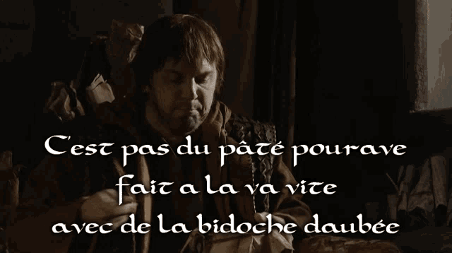 a man sitting in a chair with the words cest pas du pate pourave fait a la va vite avec de la bidoche daubee