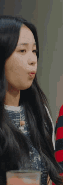 a close up of a woman 's face with long hair