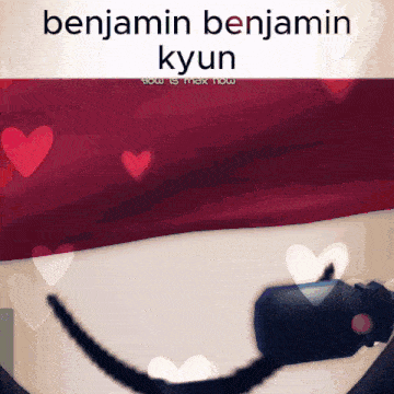 a picture of benjamin kyun with hearts surrounding him