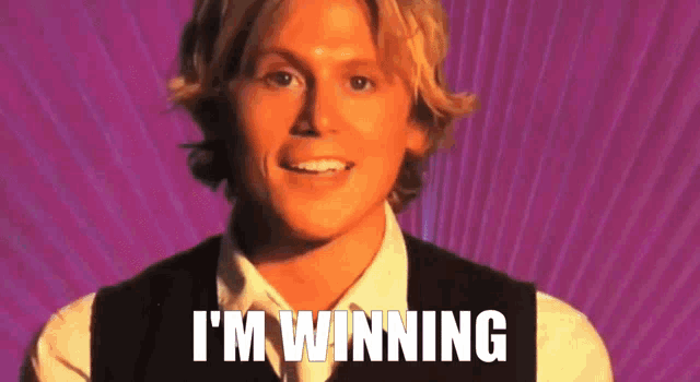 a man in a vest says i 'm winning