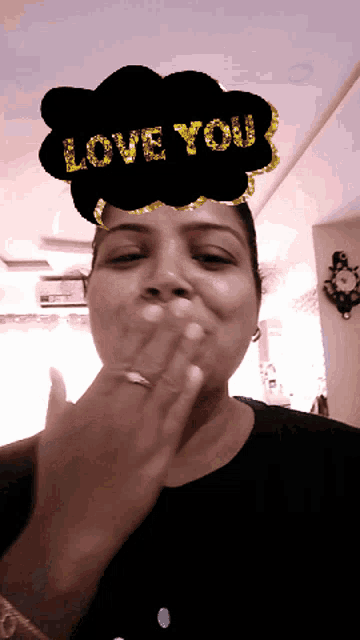 a woman blowing a kiss with a cloud that says love you