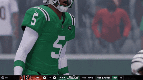 a football player in a green jersey with the number 5