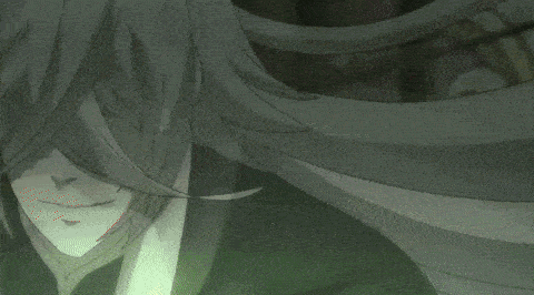 a man with long grey hair is holding a green object in his hands